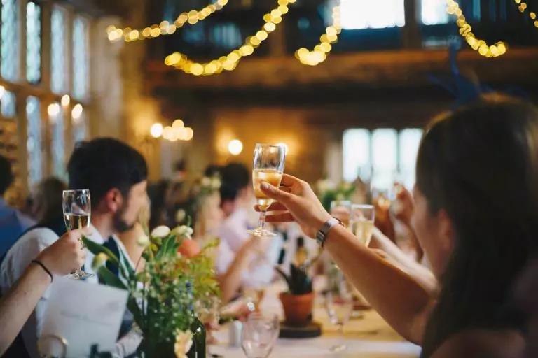 Guests Enjoying Wedding Celebration with wines