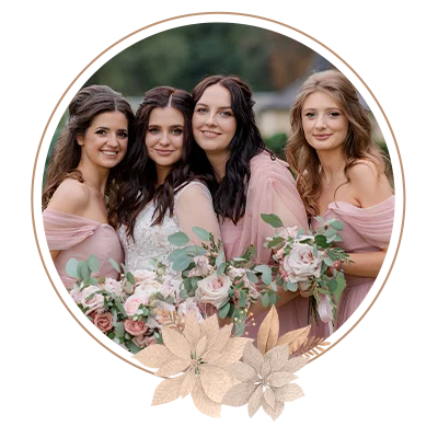 Beautiful bride with bridesmaids dressed in pink dresses are holding pale pink bouquets