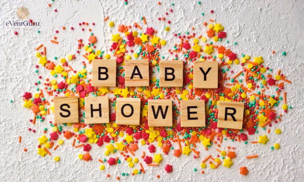 White textured background with colorful baby shower wooden words