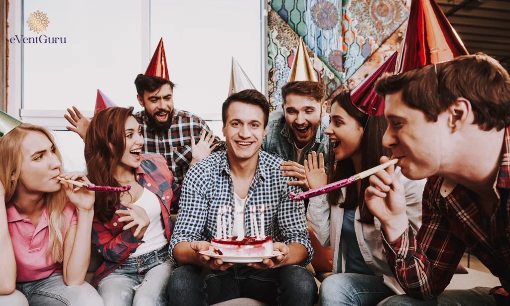 A young man is celebrating his birthday with a group of friends