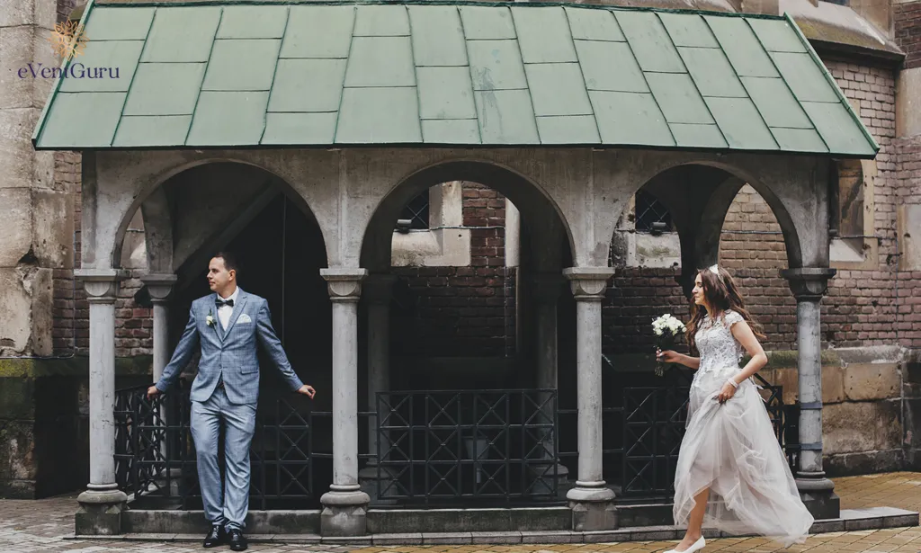In the background of a church province wedding, a stylish happy bride and groom walk together
