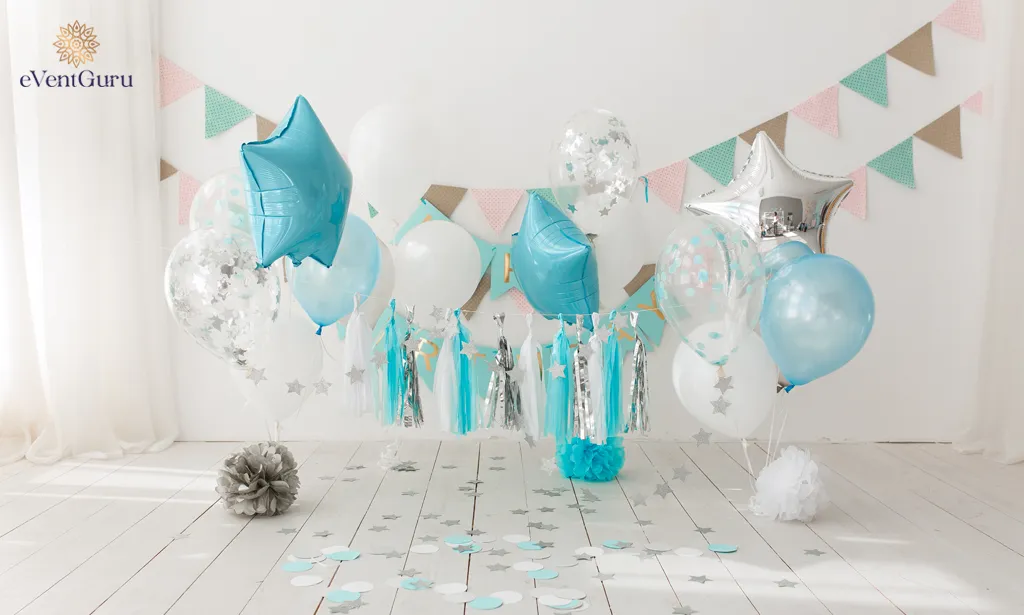 Blue balloons and gourmet cake decorate the background of a birthday celebration