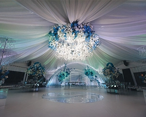Luxury wedding tent decor with blue and white flowers