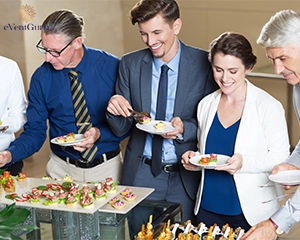 Group of five business people standing in buffet of restaurant
