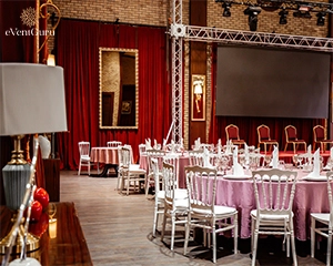 Classic restaurant with red curtains and stage
